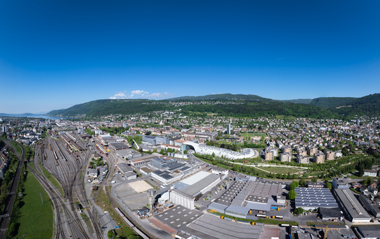 Aerial view of the Biel Bienne Boezingenfeld Champ industrial area with modern architecture and railway tracks in Biel Bienne Canton of Bern Switzerland.