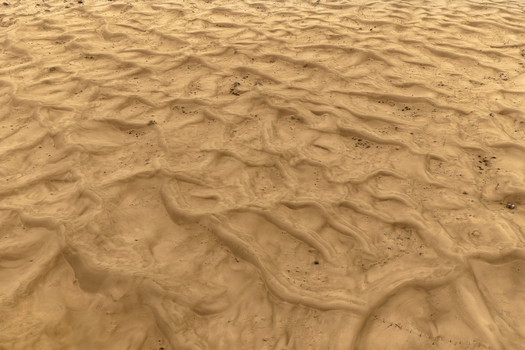 Aerial view of the intricate patterns of sand ripples in the desert in Senek Mangystau Region Kazakhstan.
