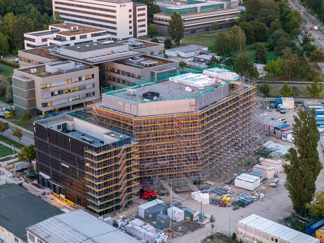 Aerial view of Helmholtz Zentrum Berlin Science Campus with research buildings extensive scaffolding on construction sites and surrounding greenery in Berlin Berlin Germany.