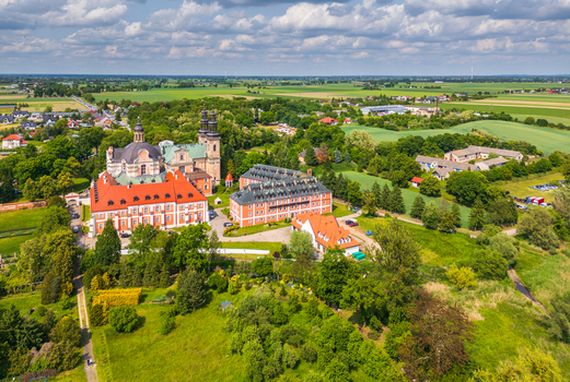 Aerial view of the historic Cistercian Abbey in Lad located within the Nadwarcianski Park Krajobrazowy featuring red roofed buildings in Lad Greater Poland Voivodeship Poland. Aerial view of the historic Cistercian Abbey in Lad located within the Nadwarcianski Park Krajobrazowy featuring red roofed buildings in Lad Greater Poland Voivodeship Poland.