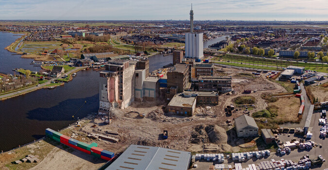 Aerial view of the skeletal remains of the Meneba Flour Mill against the backdrop of the river Zaan Wormerveer Netherlands. Aerial view of the skeletal remains of the Meneba Flour Mill against the backdrop of the river Zaan Wormerveer Netherlands.