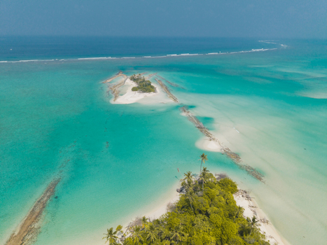 Aerial view of turquoise waters embrace sandy pathways connecting lush tropical islands a vibrant tapestry of nature s artistry Thuraakunu Thiladhunmathee Uthuruburi Maldives. Aerial view of turquoise waters embrace sandy pathways connecting lush tropical islands a vibrant tapestry of nature s artistry Thuraakunu Thiladhunmathee Uthuruburi Maldives.