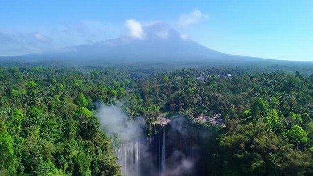 Aerial view of Tumpak Sewu Waterfall and Mount Semeru Indonesia.