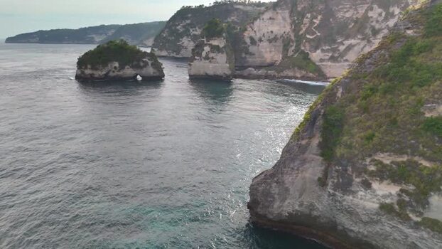 Aerial view of Diamond Beach and coastal cliffs in Nusa Penida Indonesia. Aerial view of Diamond Beach and coastal cliffs in Nusa Penida Indonesia.