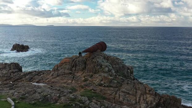 Aerial view of O Vixiador sculpture on rocky cliffs Spain.