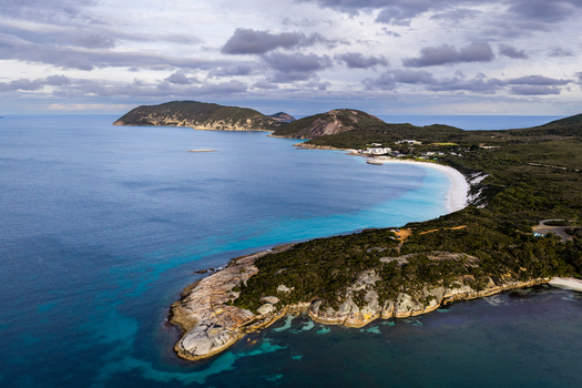 Aerial view of Frenchman Bay with turquoise waters rocky coastline and lush vegetation in Albany Western Australia Australia. Aerial view of Frenchman Bay with turquoise waters rocky coastline and lush vegetation in Albany Western Australia Australia.