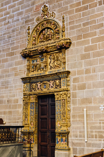 Plasencia Spain 03 December 2025 View of the ornate gilded Plateresque doorway of the Catedral Nueva de Plasencia with intricate carvings and religious figures set against a stone wall. Plasencia Spain 03 December 2025 View of the ornate gilded Plateresque doorway of the Catedral Nueva de Plasencia with intricate carvings and religious figures set against a stone wall.