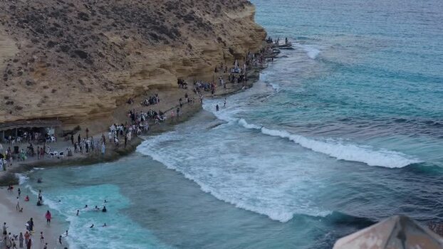 View of people enjoying the clear waters of Ageeba Beach Egypt. View of people enjoying the clear waters of Ageeba Beach Egypt.