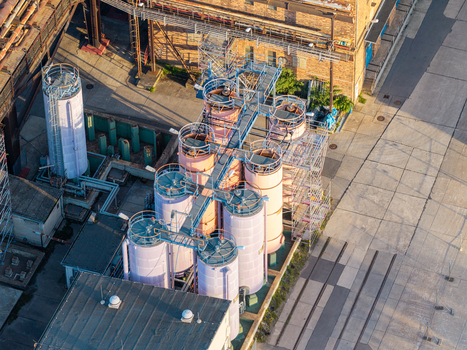 Aerial view of the Heizkraftwerk Klingenberg combined heat and power plant featuring industrial tanks scaffolding and brick structures in Berlin Berlin Germany. Aerial view of the Heizkraftwerk Klingenberg combined heat and power plant featuring industrial tanks scaffolding and brick structures in Berlin Berlin Germany.