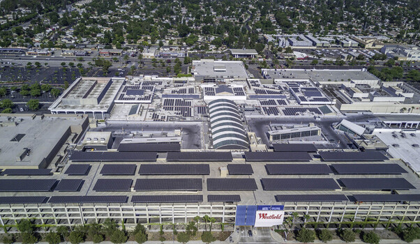 Topanga Canyon California United States 06 July 2017 Aerial view of Westfield Topanga shopping center featuring extensive solar panel arrays on the rooftop and a large parking structure.