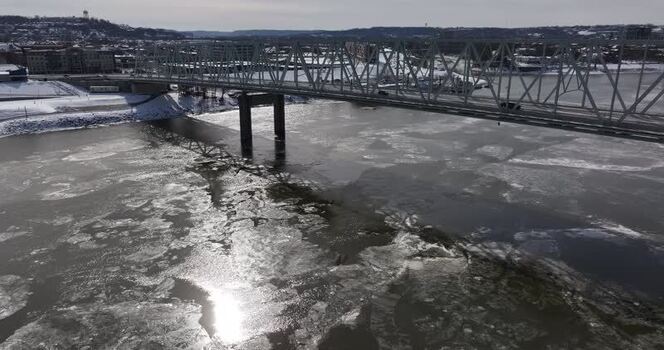 Aerial view of a truss bridge over an icy river in Cincinnati United States.