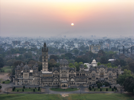 Vadodara India 14 March 2026 Aerial view of Laxmi Vilas Palace with its intricate Indo Saracenic architecture domes and tall tower at sunset over the city skyline. Vadodara India 14 March 2026 Aerial view of Laxmi Vilas Palace with its intricate Indo Saracenic architecture domes and tall tower at sunset over the city skyline.