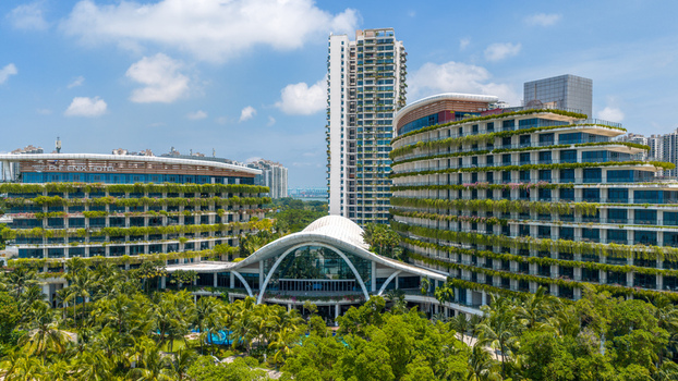 Aerial view of Forest City featuring modern hotel architecture with lush vertical gardens swimming pools and surrounding tropical vegetation in Gelang Patah Johor Darul Ta zim Malaysia. Aerial view of Forest City featuring modern hotel architecture with lush vertical gardens swimming pools and surrounding tropical vegetation in Gelang Patah Johor Darul Ta zim Malaysia.