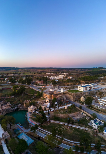 Aerial view of the historic Katas Raj Temple Complex featuring its sacred pond ancient stone structures and surrounding landscape in Katas Punjab Pakistan. Aerial view of the historic Katas Raj Temple Complex featuring its sacred pond ancient stone structures and surrounding landscape in Katas Punjab Pakistan.