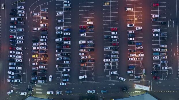 Aerial view of a busy parking lot filled with cars in Russia. Aerial view of a busy parking lot filled with cars in Russia.