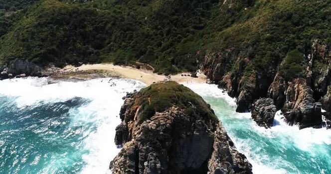Aerial view of Cepe beach with rocky cliffs and waves Venezuela.