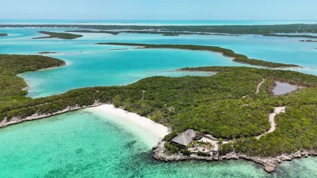 Aerial view of Crab Cay island and turquoise waters The Bahamas.