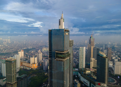 South Jakarta Indonesia 10 January 2026 Aerial view of the Autograph Tower and modern skyscrapers in the city skyline under a dramatic cloudy sky. South Jakarta Indonesia 10 January 2026 Aerial view of the Autograph Tower and modern skyscrapers in the city skyline under a dramatic cloudy sky.