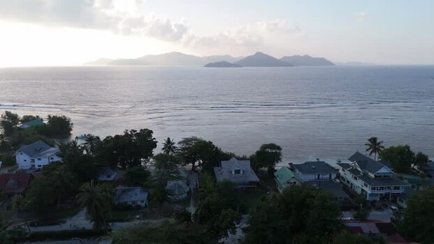 Aerial view of Anse Reunion beach and coastal houses Seychelles.