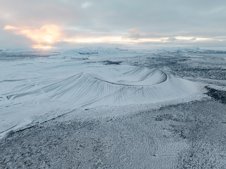 Aerial view of Hverfjall crater covered in snow within the volcanic landscape of Thingeyjarsveit Iceland. Aerial view of Hverfjall crater covered in snow within the volcanic landscape of Thingeyjarsveit Iceland.