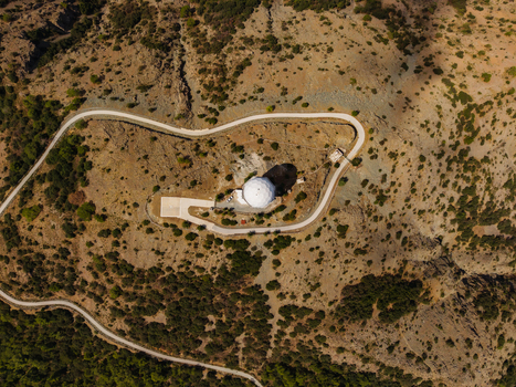 Aerial view of the Kionia radar dome situated on a mountain ridge surrounded by rugged terrain and winding roads in Lazanias Lefkosia Cyprus. Aerial view of the Kionia radar dome situated on a mountain ridge surrounded by rugged terrain and winding roads in Lazanias Lefkosia Cyprus.