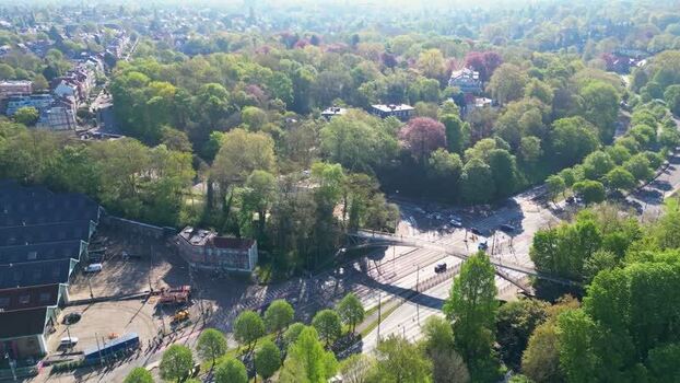 Aerial view of a lush green park and road intersection Belgium. Aerial view of a lush green park and road intersection Belgium.
