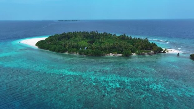 Aerial view of the tropical island of Kamadhoo Maldives. Aerial view of the tropical island of Kamadhoo Maldives.