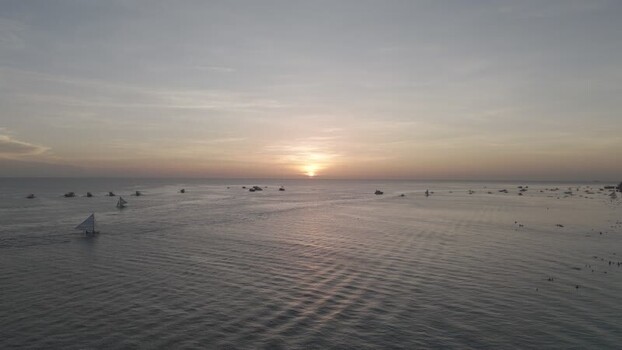 Aerial view of sailboats at sunset off Boracay Island Philippines.