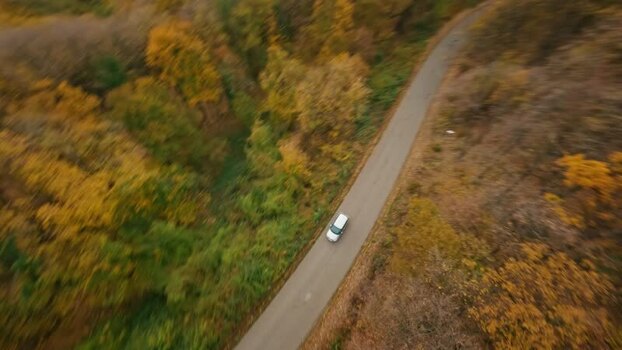 FPV aerial view of car on road in Fruska Gora SERBIA. FPV aerial view of car on road in Fruska Gora SERBIA.