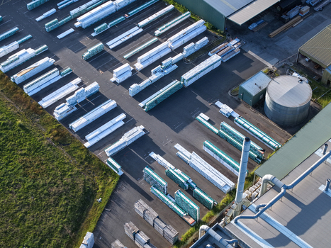 Melbourne VIC Australia 22 September 2026 Aerial view of industrial factories in Kilsyth featuring rows of stacked construction materials a storage tank and warehouses. Melbourne VIC Australia 22 September 2026 Aerial view of industrial factories in Kilsyth featuring rows of stacked construction materials a storage tank and warehouses.