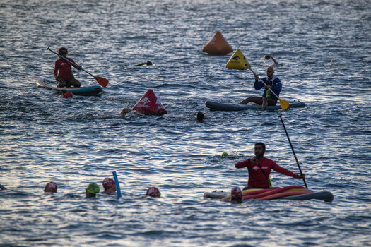 Rio de Janeiro Brazil 06 June 2026 View of swimmers and paddleboarders navigating around buoys during an open water competition at Red Beach.