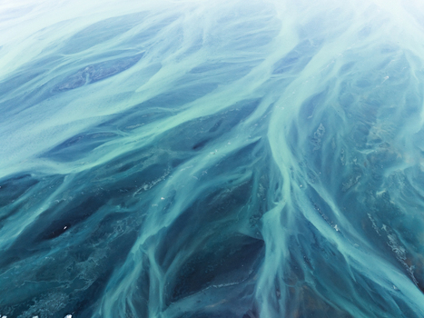 Aerial view of the intricate turquoise colored braided river channels of a glacial landscape in Iceland. Aerial view of the intricate turquoise colored braided river channels of a glacial landscape in Iceland.