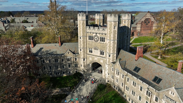 Aerial view of Blair Arch and the historic collegiate gothic architecture of Princeton University with students walking on the campus grounds in Princeton New Jersey United States.