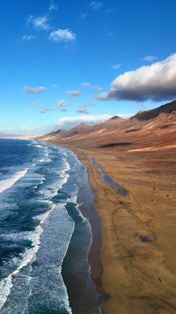 Aerial view of Playa del Confital beach and mountains Spain.