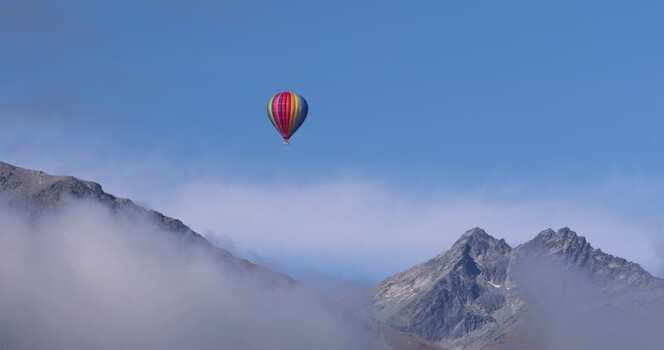 View of hot air balloon over mountains New Zealand. View of hot air balloon over mountains New Zealand.