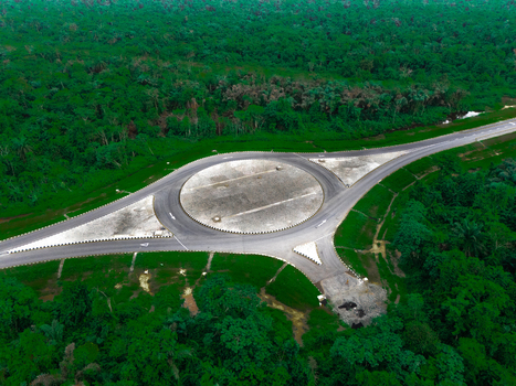 Aerial view of the roundabout on Bonny Island surrounded by dense tropical forest in Bonny Town Rivers Nigeria. Aerial view of the roundabout on Bonny Island surrounded by dense tropical forest in Bonny Town Rivers Nigeria.