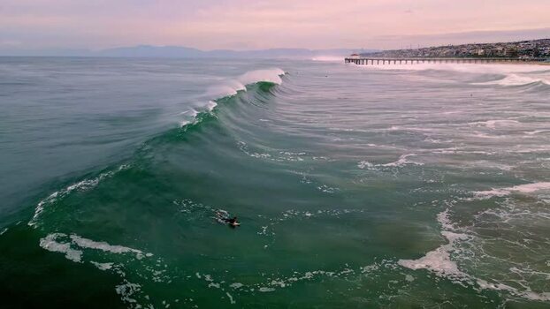 Aerial view of a surfer on a wave in Los Angeles United States.