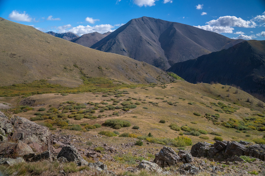 Aerial view of San Luis Peak and the rugged terrain of the South Ridge near West Willow Creek Trailhead featuring rocky slopes and alpine vegetation in Gunnison Colorado United States.