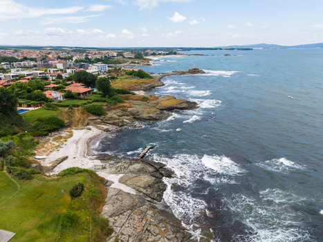 Aerial view of The clam beach with its rocky coastline sandy shore and coastal villas in Lozenets Burgas Bulgaria. Aerial view of The clam beach with its rocky coastline sandy shore and coastal villas in Lozenets Burgas Bulgaria.