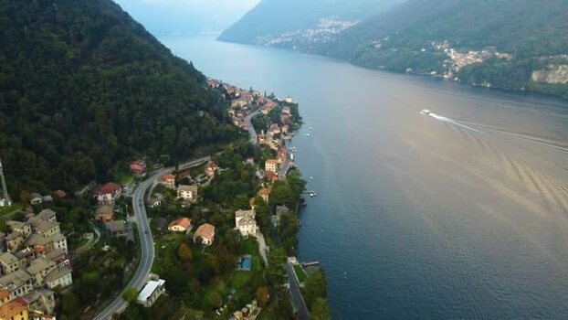 Aerial view of Lake Como with shoreline villas and road Italy. Aerial view of Lake Como with shoreline villas and road Italy.