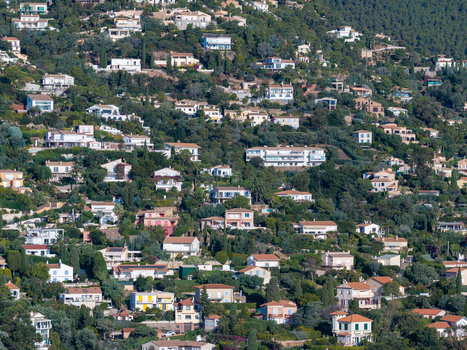 Aerial view of Le Trayas featuring numerous villas nestled among lush Mediterranean greenery and trees on a hillside in Saint Raphael Provence Alpes Cote d Azur France. Aerial view of Le Trayas featuring numerous villas nestled among lush Mediterranean greenery and trees on a hillside in Saint Raphael Provence Alpes Cote d Azur France.