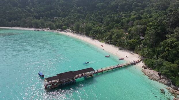 Aerial view of Perhentian Islands pier and turquoise water Malaysia. Aerial view of Perhentian Islands pier and turquoise water Malaysia.