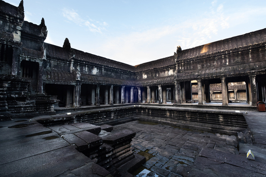 View of the ancient stone courtyard and colonnaded galleries within the historic Angkor Wat temple complex in Krong Siem Reap Siem Reap Province Cambodia.