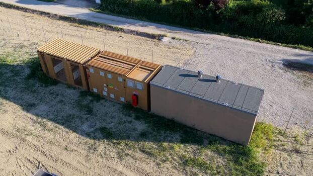 Aerial view of utility containers in a field Italy.