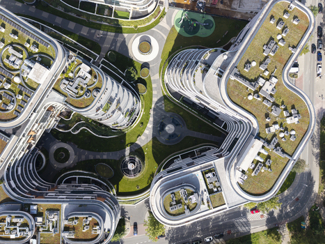 Aerial view of modern organic shaped apartment buildings with green roofs and landscaped courtyards in Krakow Lesser Poland Voivode Poland.