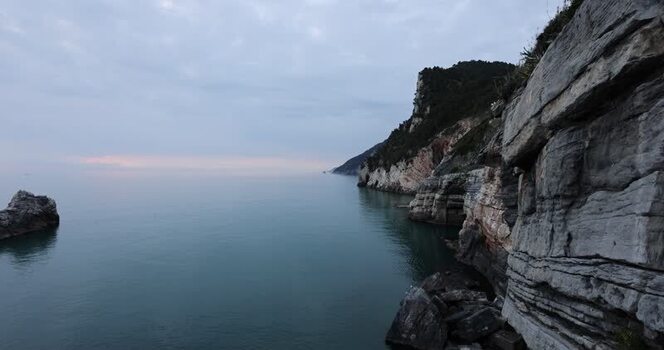 View of a rocky bay at dusk Italy.
