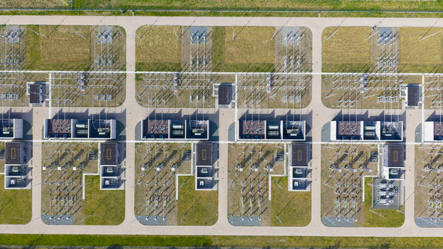 Aerial view of an electrical substation with symmetrical rows of power transformers and high voltage equipment in Velsen Noord North Holland Netherlands.