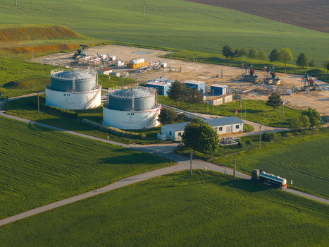 Aerial view of UGS Damborice gas storage facility with large tanks and pump jacks surrounded by green fields Damborice South Moravian Region Czechia. Aerial view of UGS Damborice gas storage facility with large tanks and pump jacks surrounded by green fields Damborice South Moravian Region Czechia.
