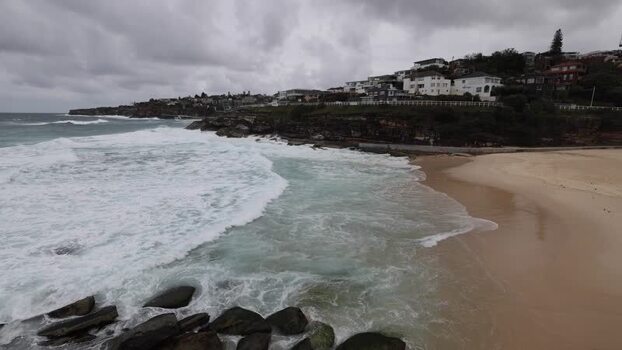 View of Bondi Beach with crashing waves in Sydney Australia.