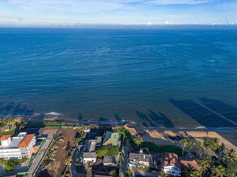 Aerial view of Negombo Beach featuring coastal buildings lush palm trees and the expansive Indian Ocean in Negombo Western Province Sri Lanka. Aerial view of Negombo Beach featuring coastal buildings lush palm trees and the expansive Indian Ocean in Negombo Western Province Sri Lanka.